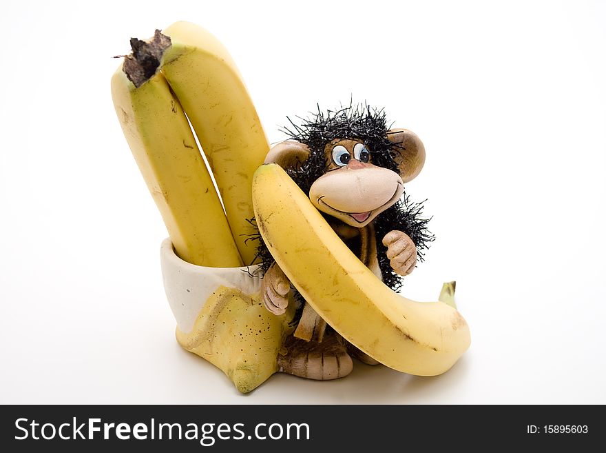 Ceramics monkey with ripe bananas. Ceramics monkey with ripe bananas