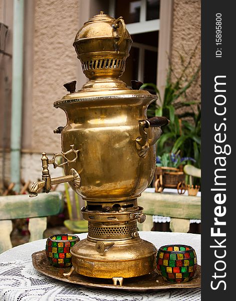 The old russin samovar at the table. The old russin samovar at the table