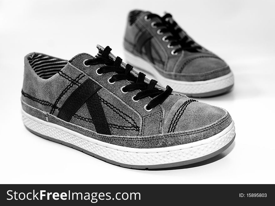 A pair of used comfortable shoes on a white background