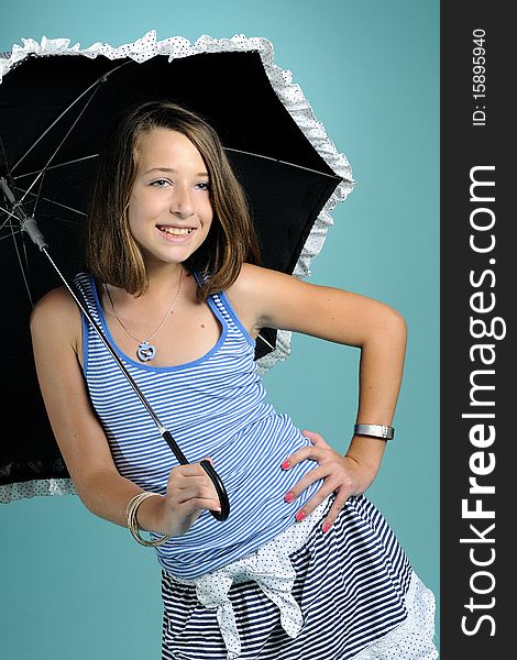 Girl smiling under umbrella