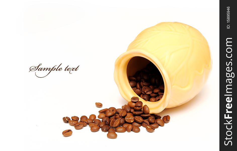 Pot and coffee beans isolated over white background