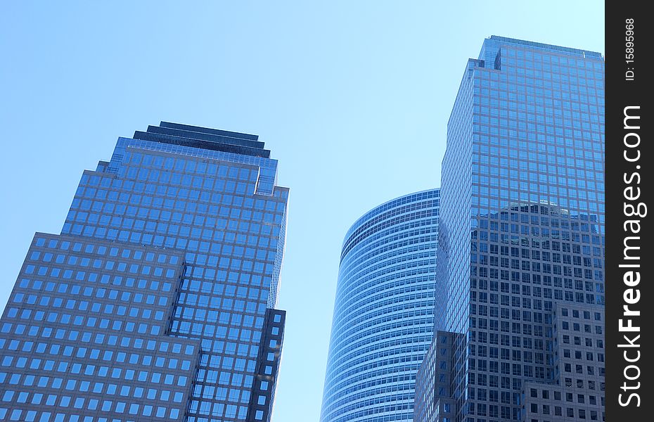 Modern business towers reflecting the blue color of the sky. Modern business towers reflecting the blue color of the sky