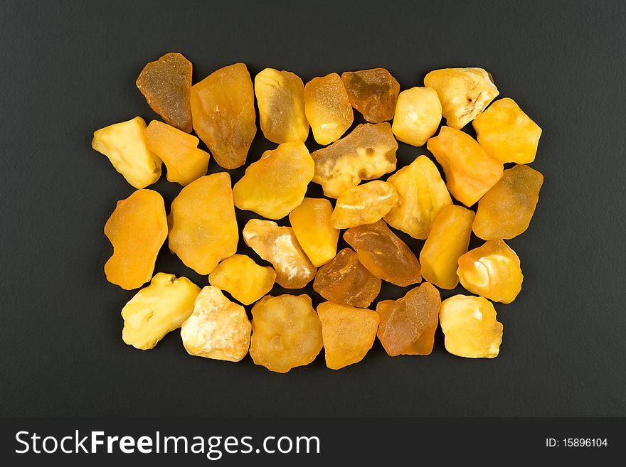 Baltic amber or true amber is a fossilized tree resin which formed about 150 m years ago, macro shot isolated on black