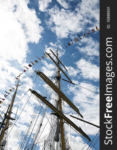 Masts of a tall Ship and cloudy blue sky. Masts of a tall Ship and cloudy blue sky