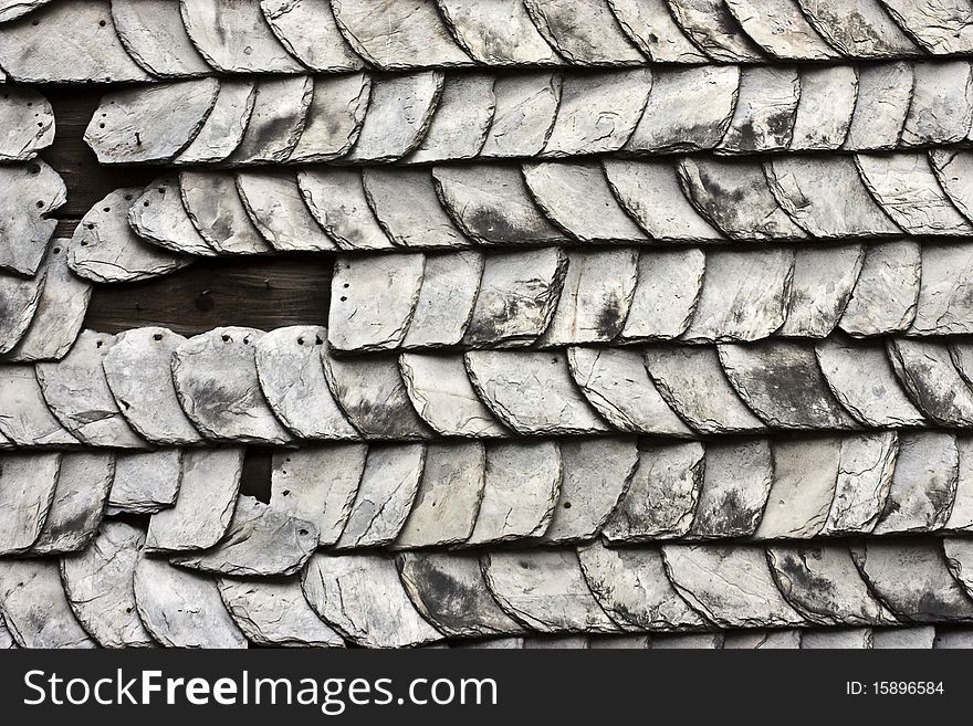 An old damaged roof with missing parts