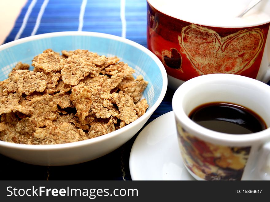 Healty breakfast with cappuccino, black coffee and flakes