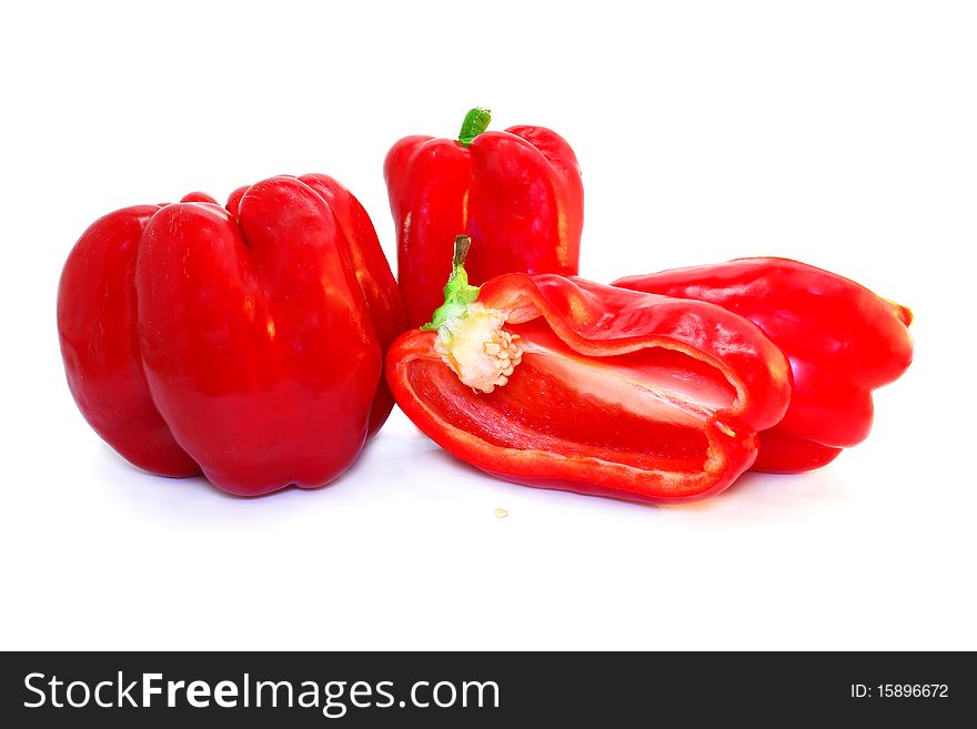 Some red sweet peppers on white background