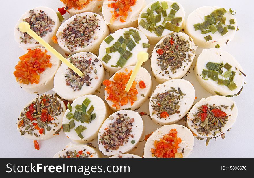 Cheese appetizers on white background