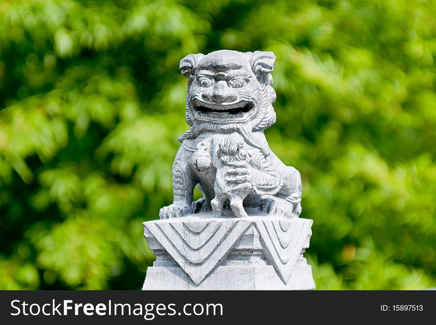 A chinese lion statue usually infront of gates and enterances for good luck.