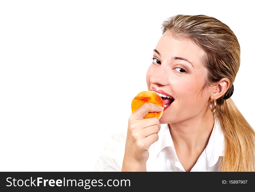 Office girl eating ripe yellow tasty peach. Office girl eating ripe yellow tasty peach