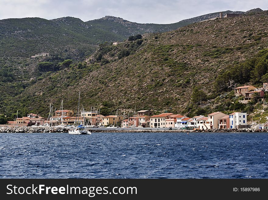 Italy, Tirrenian sea, Tuscanian islands, Capraia island, panoramic view of the port. Italy, Tirrenian sea, Tuscanian islands, Capraia island, panoramic view of the port