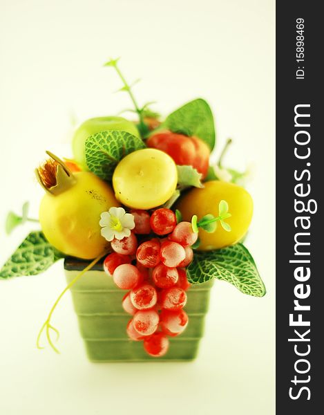 Many fruits in green basket. Many fruits in green basket