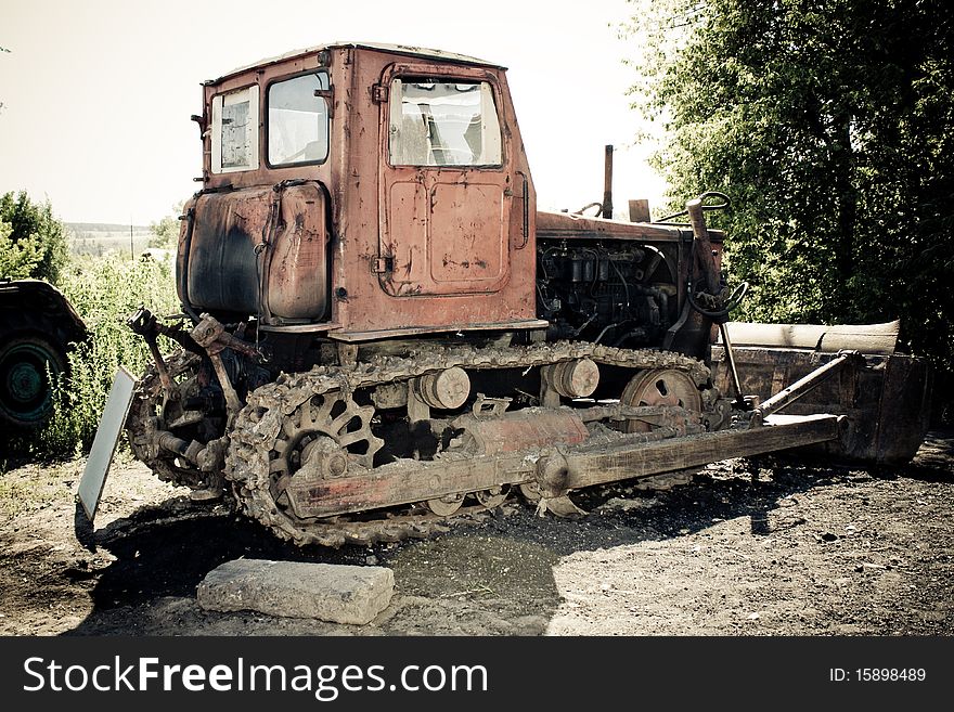 Old abandoned dilapidated tractor in rural areas. Old abandoned dilapidated tractor in rural areas