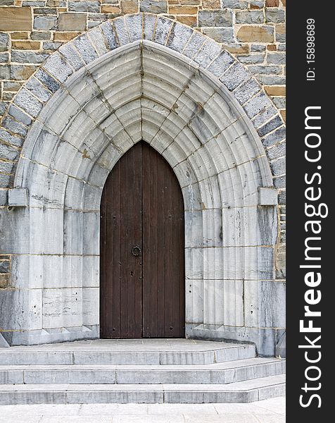 This photograph represent a view of a door of a church. This photograph represent a view of a door of a church