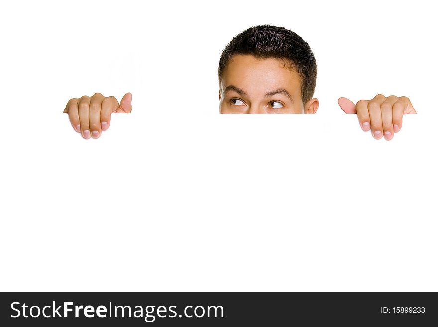 Young guy holding blank billboard