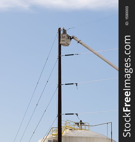 Lineman installing powerlines at a new substation.