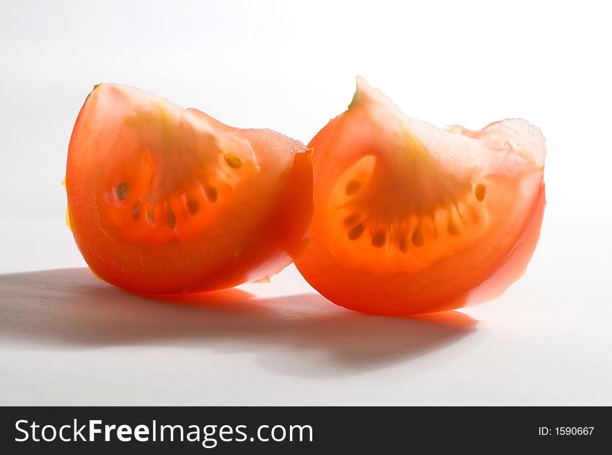 Tomato slices, lobules on the white