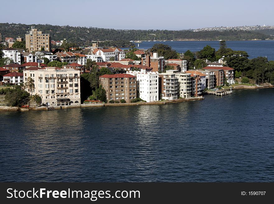 Buildings At The Sydney Harbour Coastline On A Summer Day. Buildings At The Sydney Harbour Coastline On A Summer Day