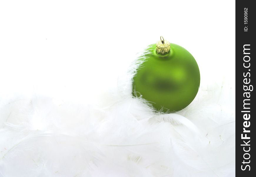 Christmas ball on white feathers. Christmas ball on white feathers