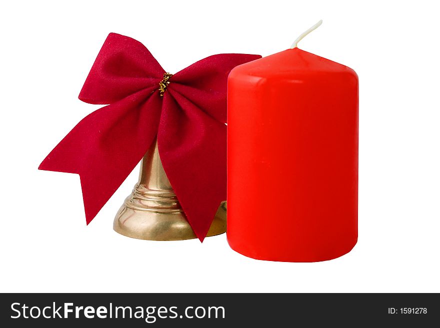 Attributes of Christmas: gold bell and candle. Isolated