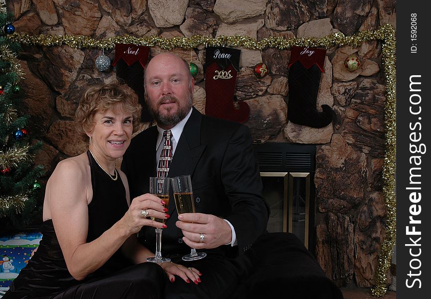 Man and Woman making a Christmas Toast with Champagne. Man and Woman making a Christmas Toast with Champagne