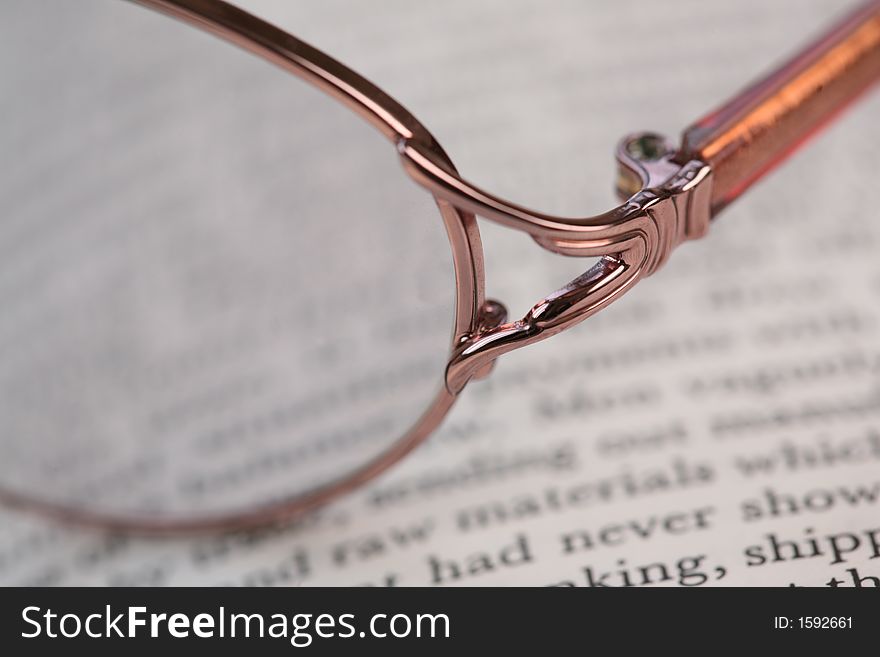Glasses on top of an open book. Glasses on top of an open book