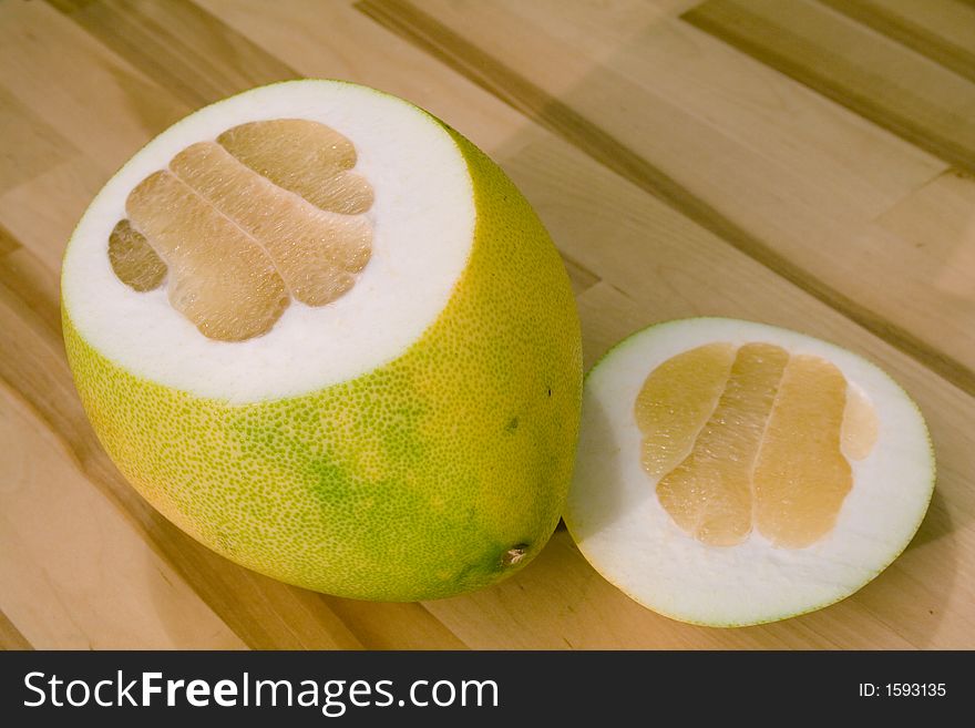 Grapefruit slices on a wooden kitchen table