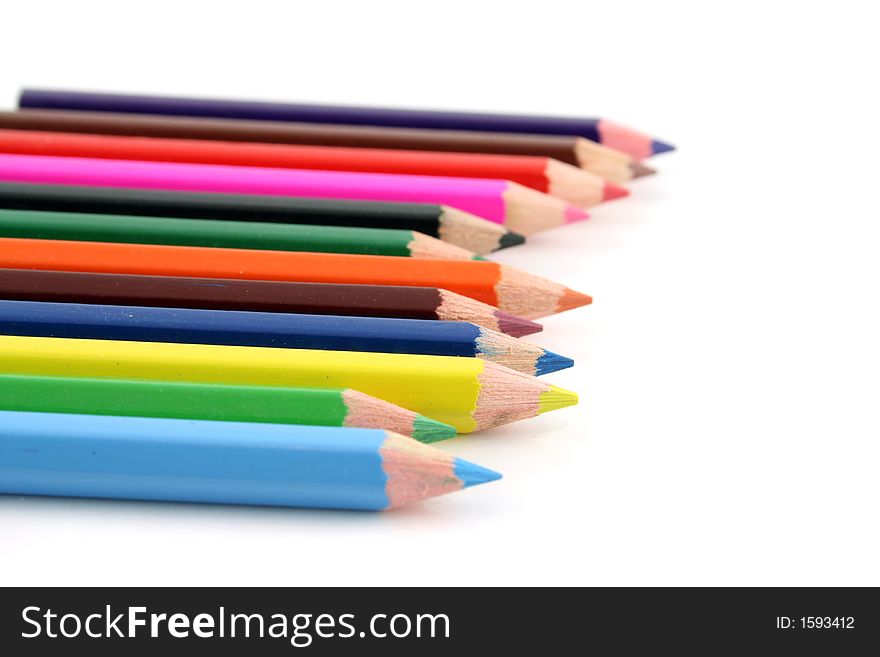 Colored pencils on a white background with a shallow DOF