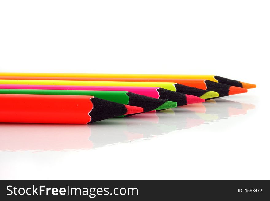 Neon Pencils in a line on a white background. Neon Pencils in a line on a white background