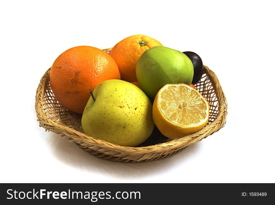 Fruit basket isolated on white background