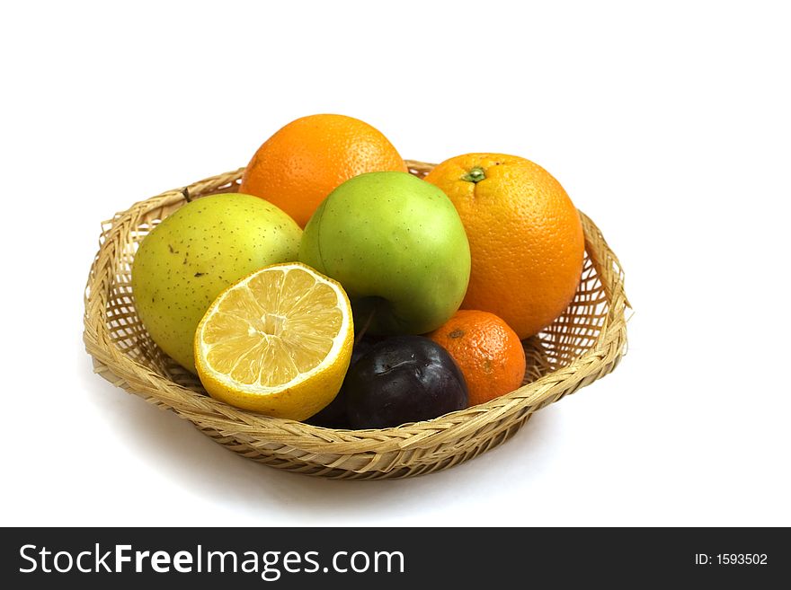 Fruit basket isolated on white