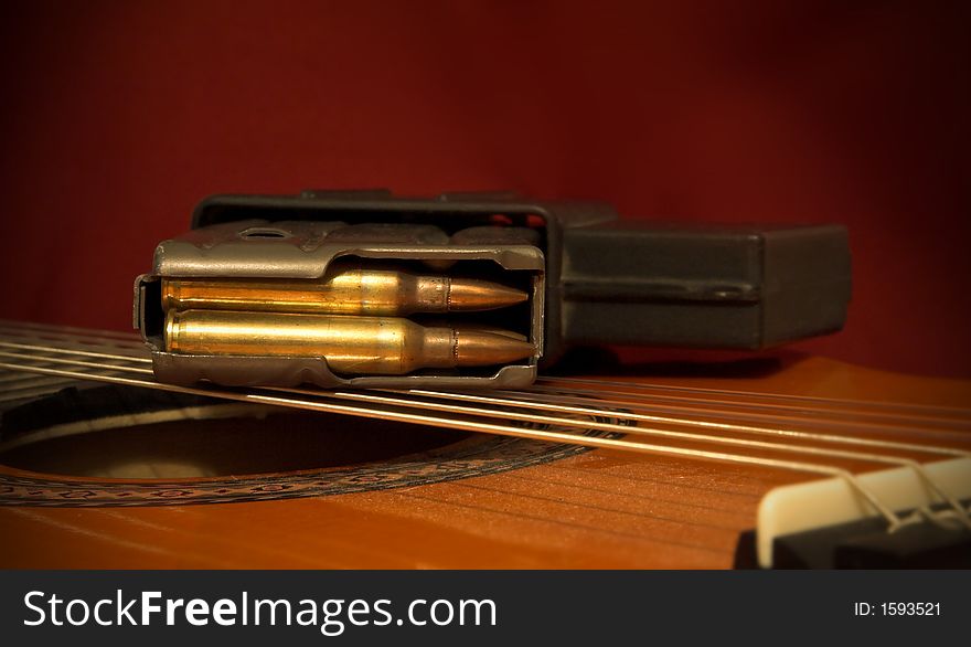 The bullet cartridge and guitar strings. The bullet cartridge and guitar strings