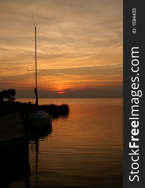 A beautiful silhouette of a boat at sunset. A beautiful silhouette of a boat at sunset