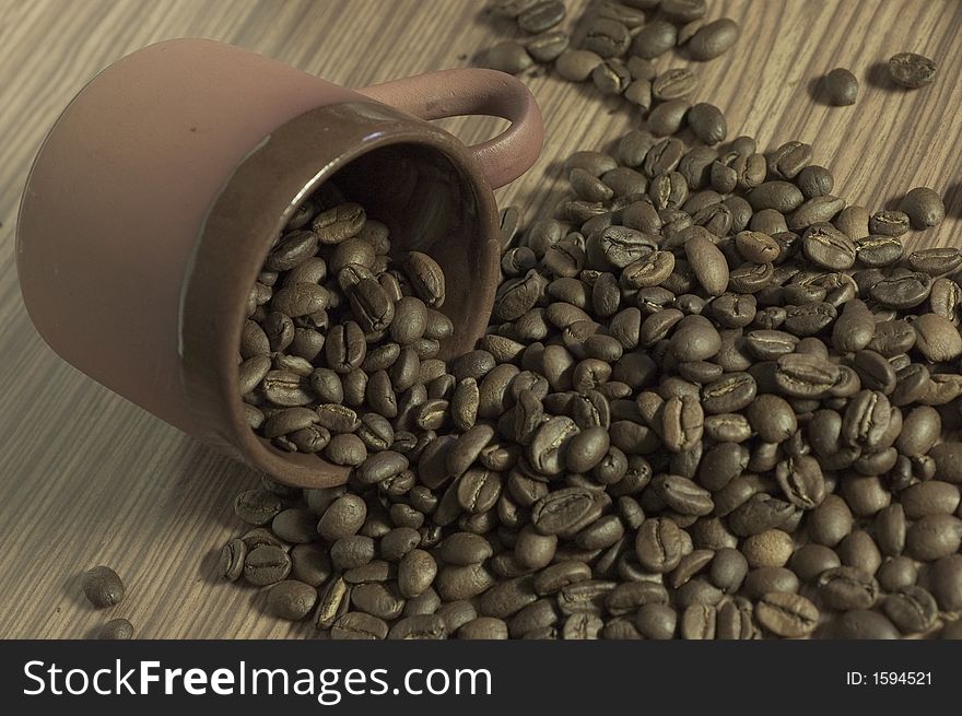 Cup Filled With Coffee Beans