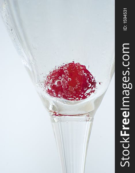 Glass of champagne with a cherry