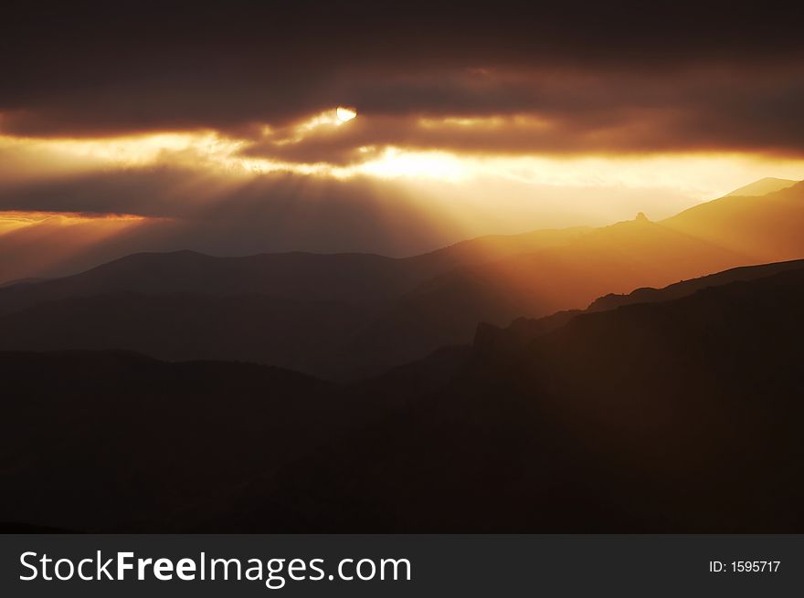 Storm weather,clouds and sun in mountain. Storm weather,clouds and sun in mountain