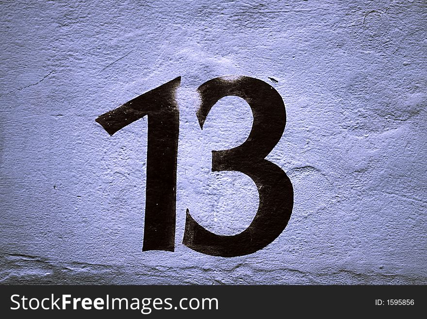 Number 13 on a wall, 13 is associated with misfortune in popular belief