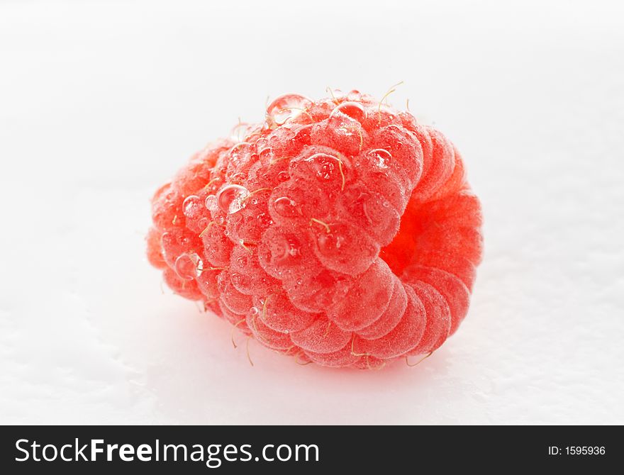 Fresh raspberry with water droplets