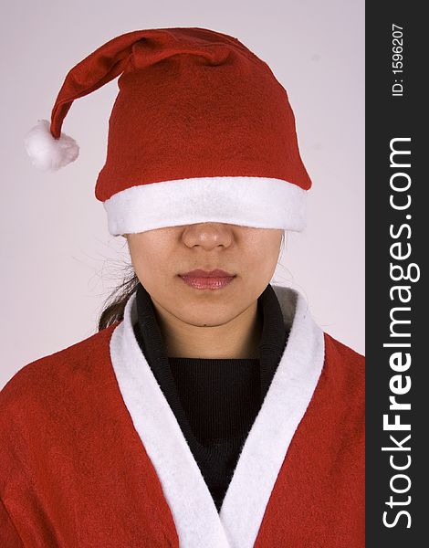 Asian girl showing See No Evil in Christmas Attire.