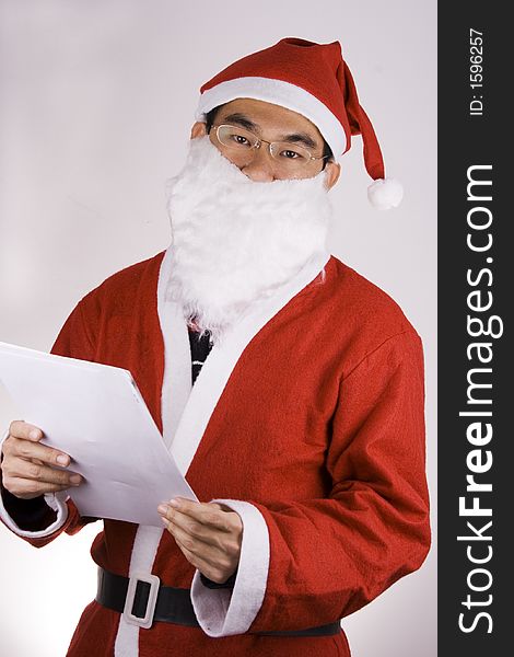 An Asian Santa Claus with check list.