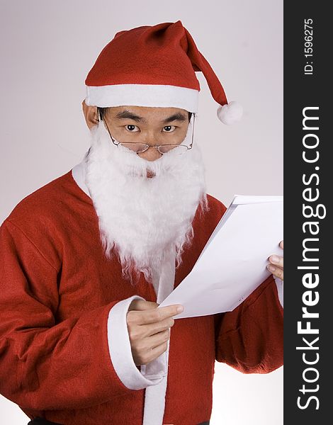 An Asian Santa Claus with check list.