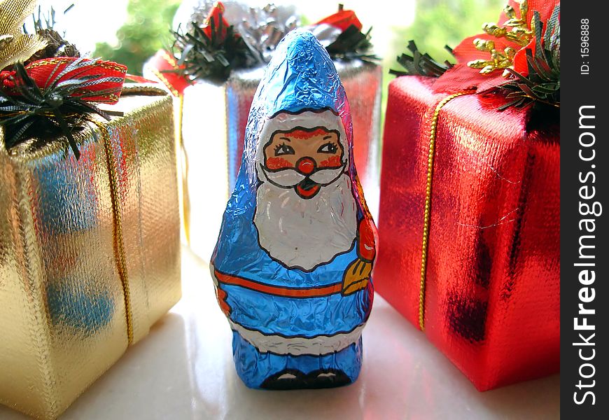 Christmas blue santa toy and presents.