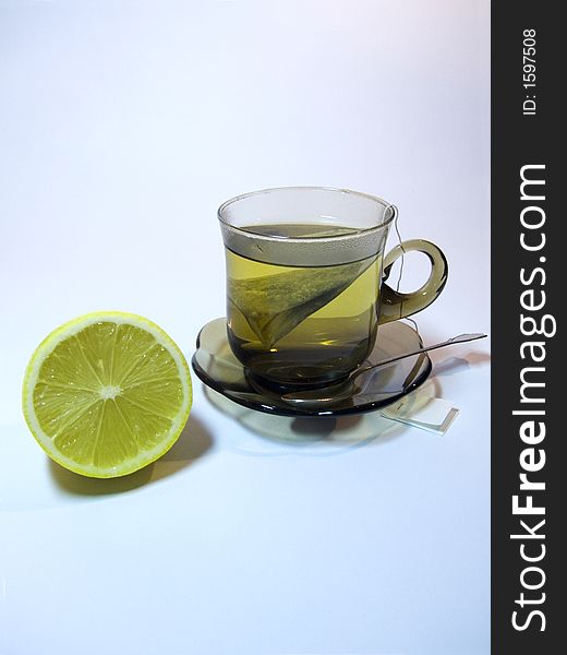 Small glass of tea with lemon