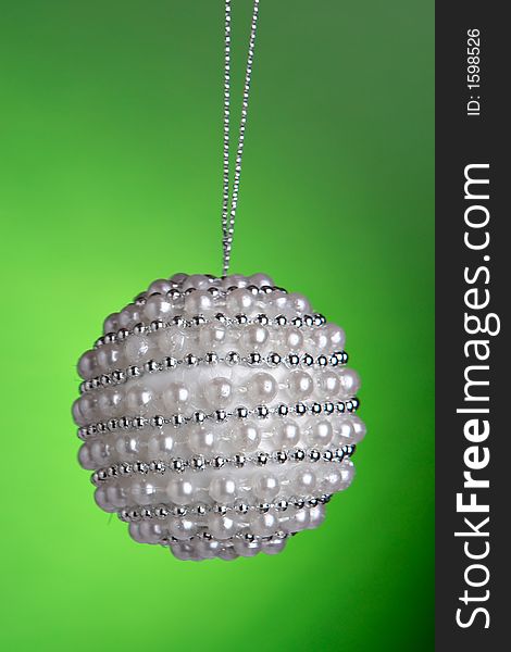 Christmas ornament hanging with green background