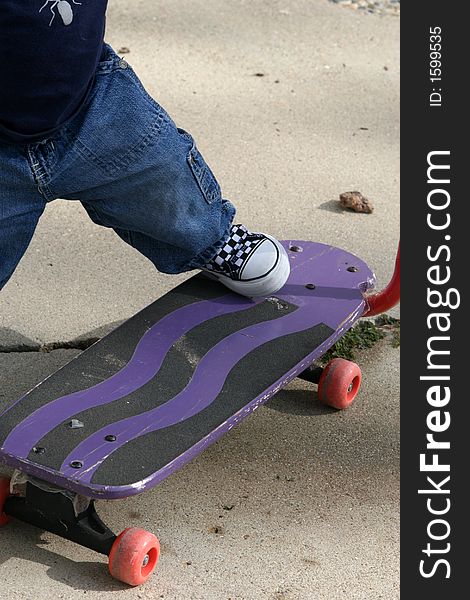 Childs foot on a skate-board, sport