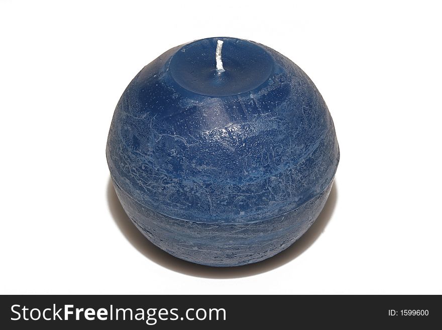 Round blue candle isolated over white