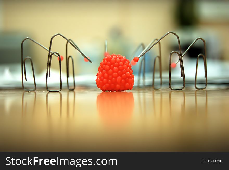 It`s macro photography with several paper-clips on the table which eat..raspberry)))). It`s macro photography with several paper-clips on the table which eat..raspberry))))