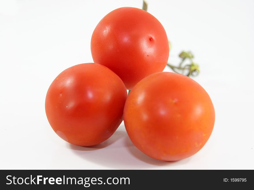 Bunch of tomatoes isolated over white