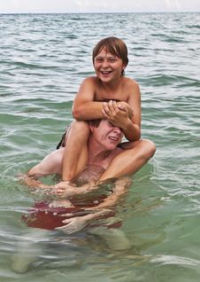 Boys Having Fun In The Beautiful Clear Sea Royalty Free Stock Photos Boys Having Fun In The Beautiful Clear Sea Royalty Free Stock Photos