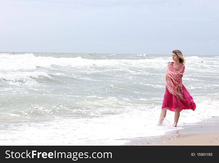 Young woman standing near the sea